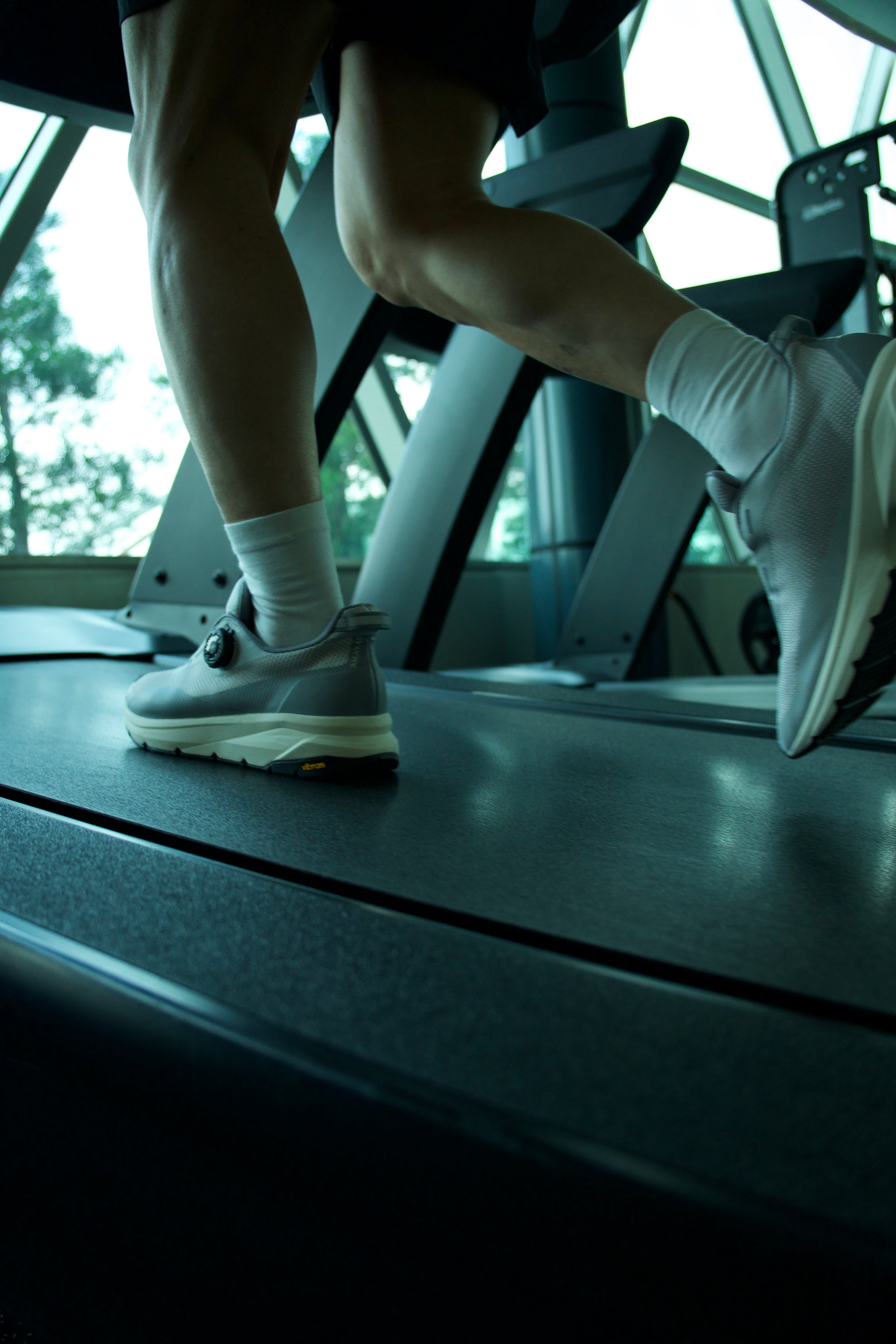 Active adult working out on inclined treadmill with AMAYAS V1 shoes